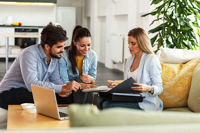 A real-estate agent helps a couple create a letter of intent.