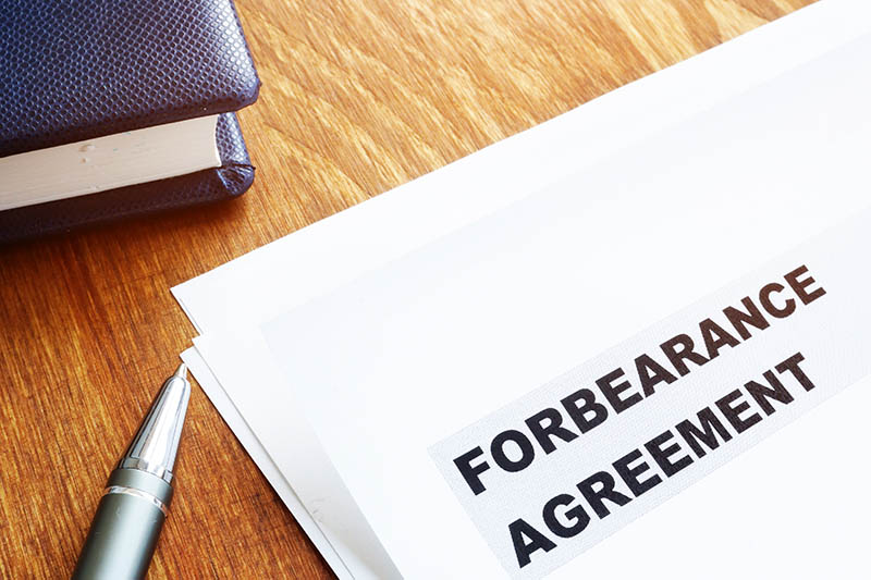 Forbearance agreement waiting to be signed by homeowner impacted by COVID-19.